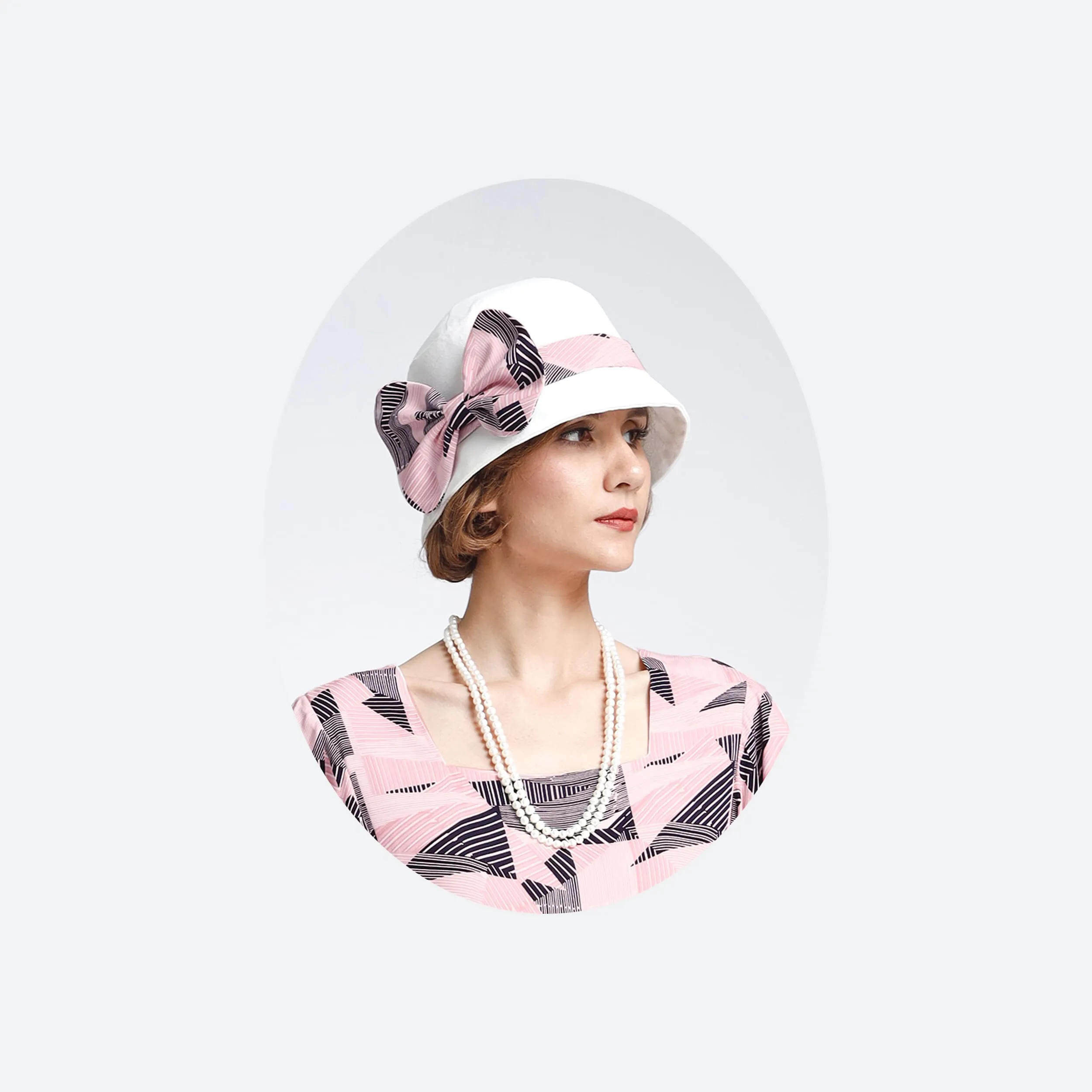1920s off-white cloche hat with pink and black ribbon