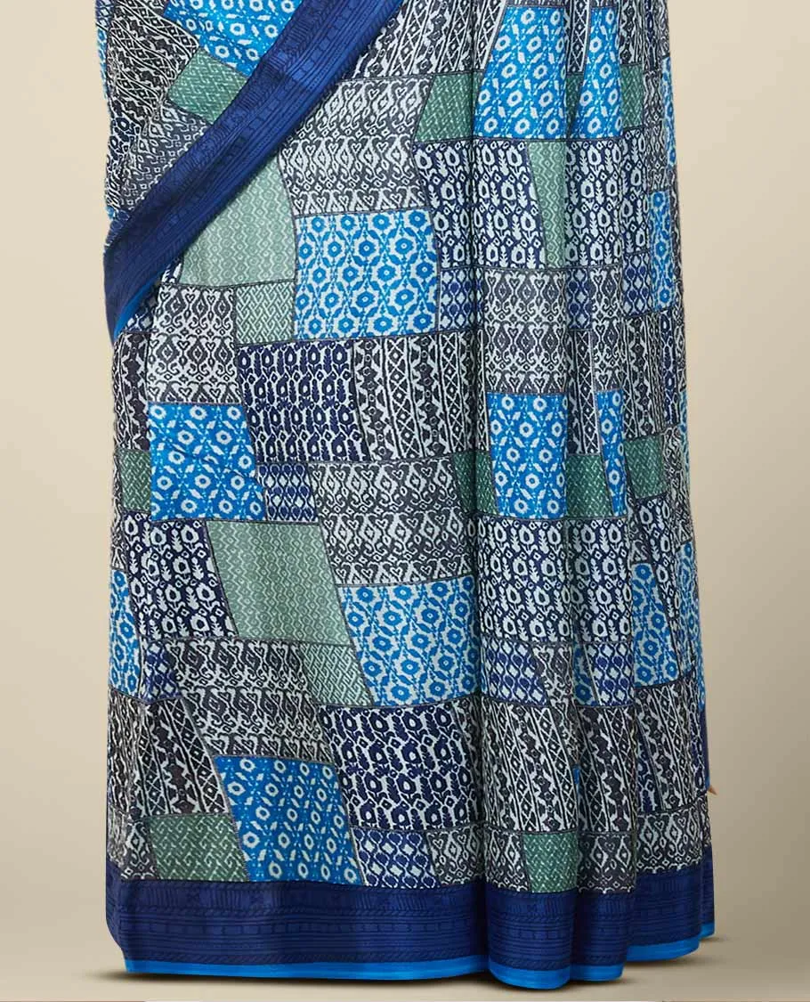 Multi-color geometric patterns printed semi banaras crepe saree, contrast blue border printed with unique motifs