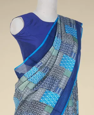 Multi-color geometric patterns printed semi banaras crepe saree, contrast blue border printed with unique motifs