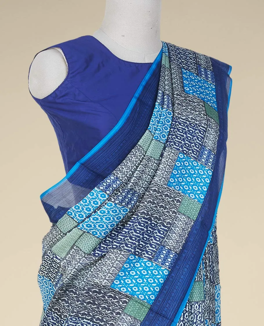 Multi-color geometric patterns printed semi banaras crepe saree, contrast blue border printed with unique motifs