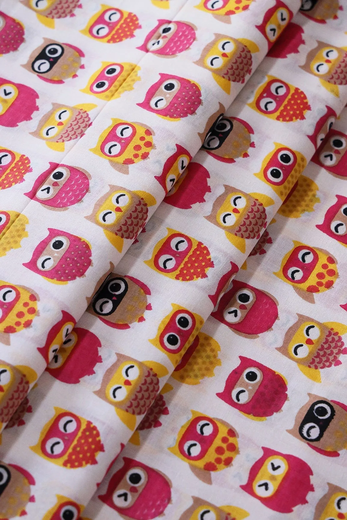 Pink And Yellow Quirky Pattern Print On Off White Pure Cotton Fabric