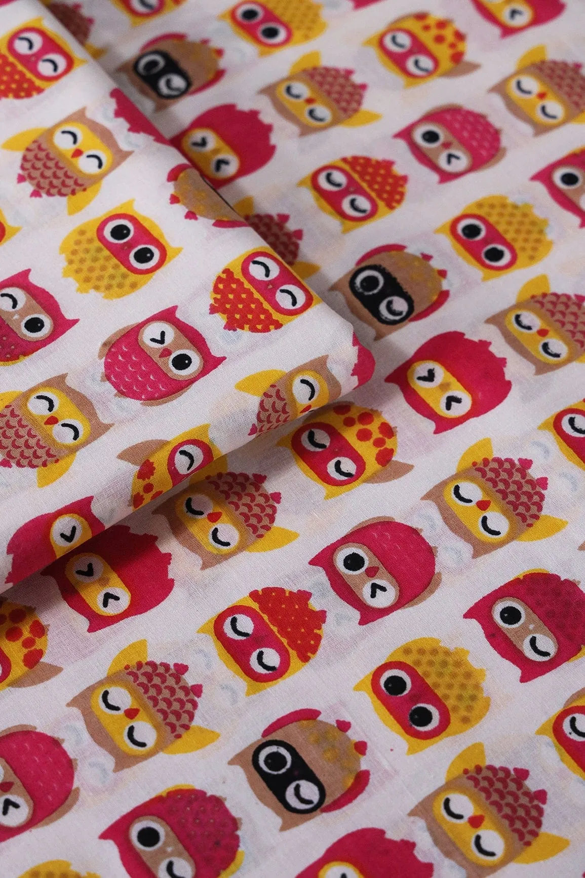 Pink And Yellow Quirky Pattern Print On Off White Pure Cotton Fabric